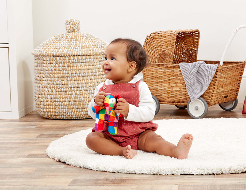 This cute Elmer Rattle is made from baby soft plush and has a gentle chime. Sold by Say It Baby Gifts