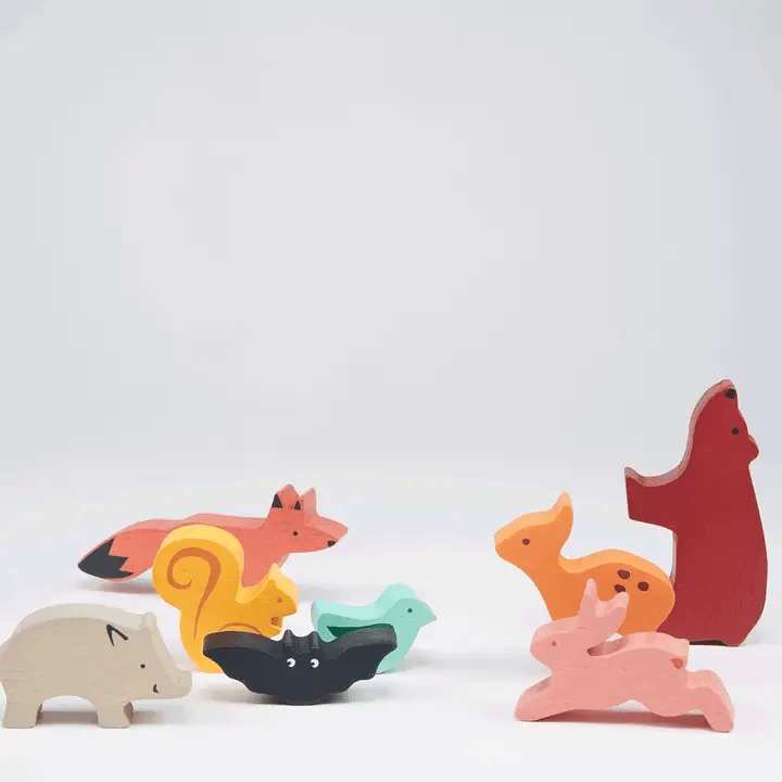 Mentari Happy Stacking Forest. Set of colorful wooden animal toys on a light gray background