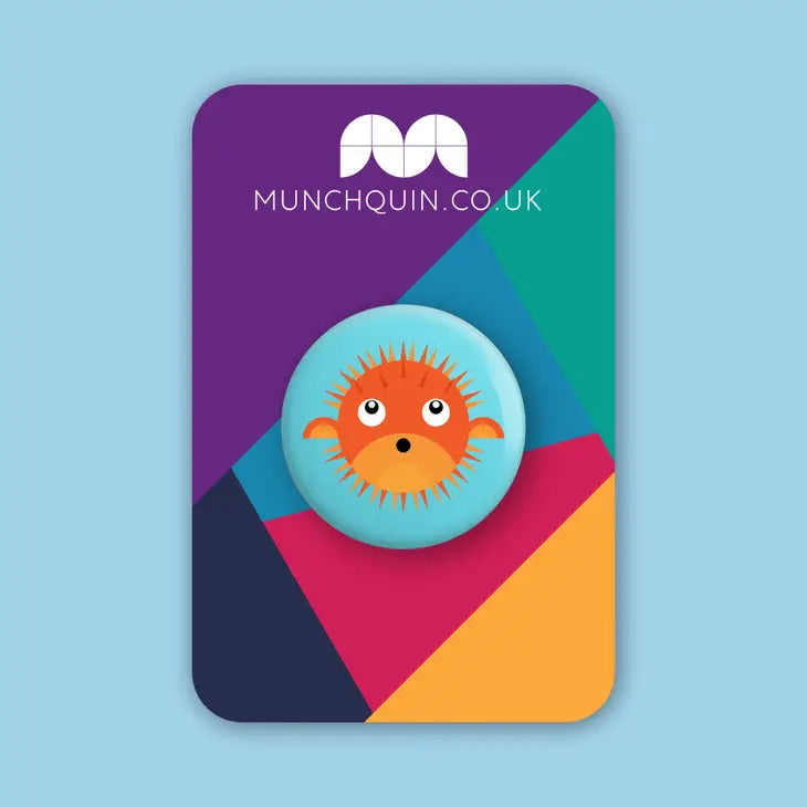 Hey There Munchquin Pufferfish Button Badge - a quirky and fun pin badge featuring a cute orange pufferfish! Sold by Say It Baby Gifts