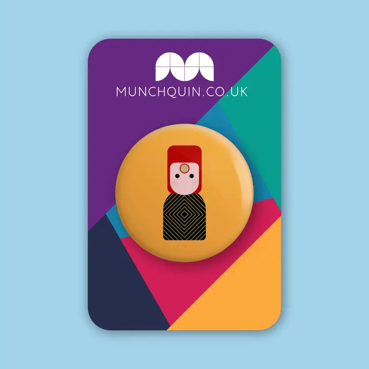 Munchquin David Bowie As Ziggy Stardust Button Badge - a quirky and fun pin badge featuring the legendary David Bowie.