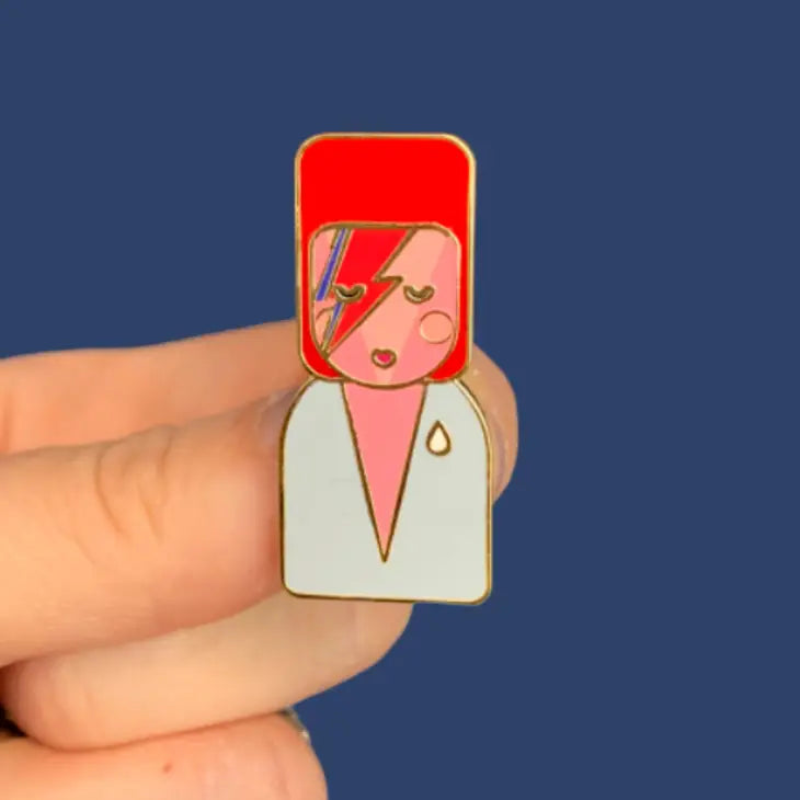 Munchquin David Bowie As Ziggy Stardust Hard Enamel Pin - a quirky and fun enamel pin badge featuring the legendary David Bowie.