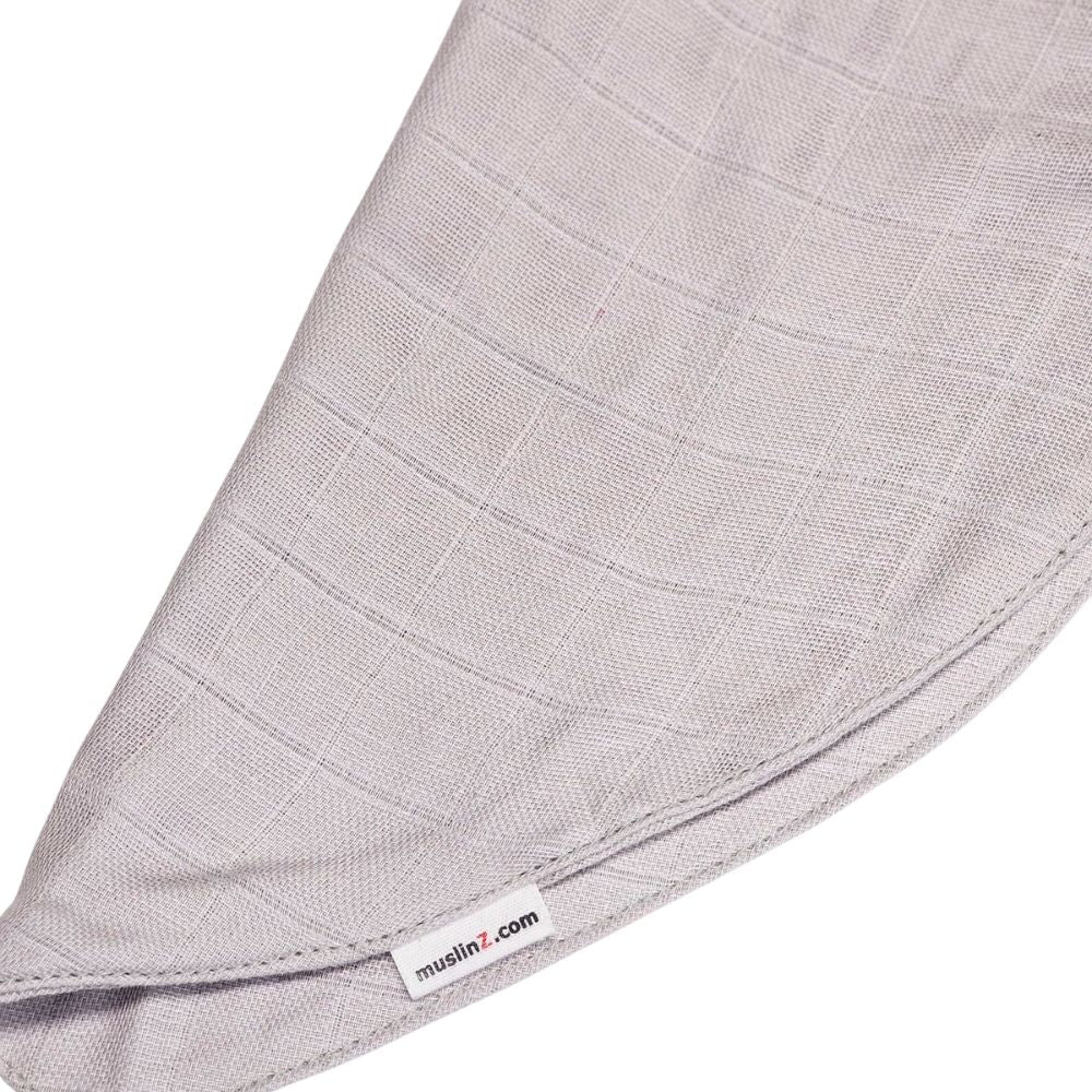 Muslinz Mini Muzi - Sensory Gray textured fabric with a visible brand label Muslinz on a white background