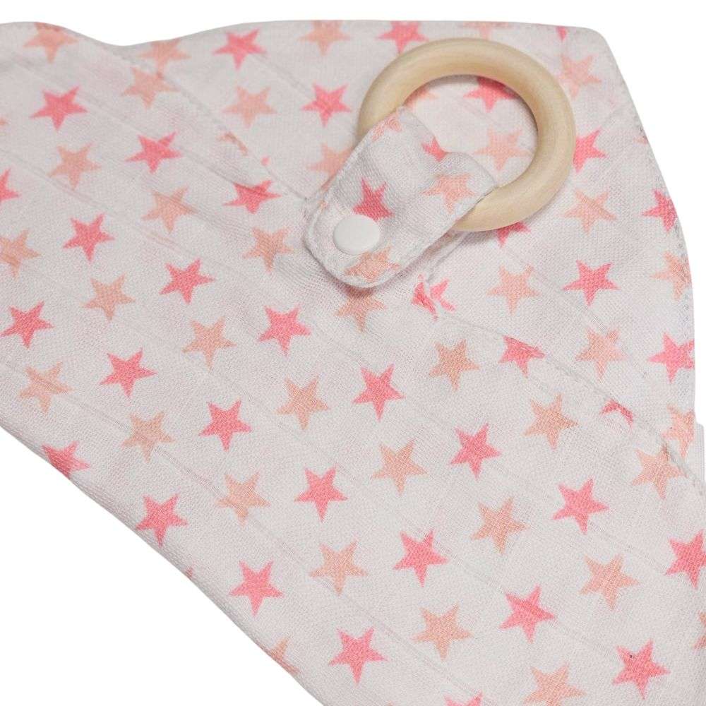 Muslinz Mini Muzi - Pink Star Baby muslin with star pattern and wooden teething ring on a white background
