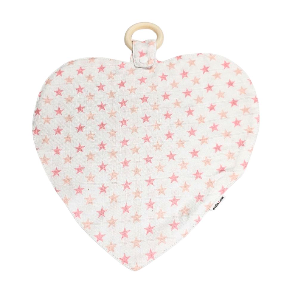 Muslinz Mini Muzi - Pink Star. Heart-shaped baby teether with pink star pattern on a white background