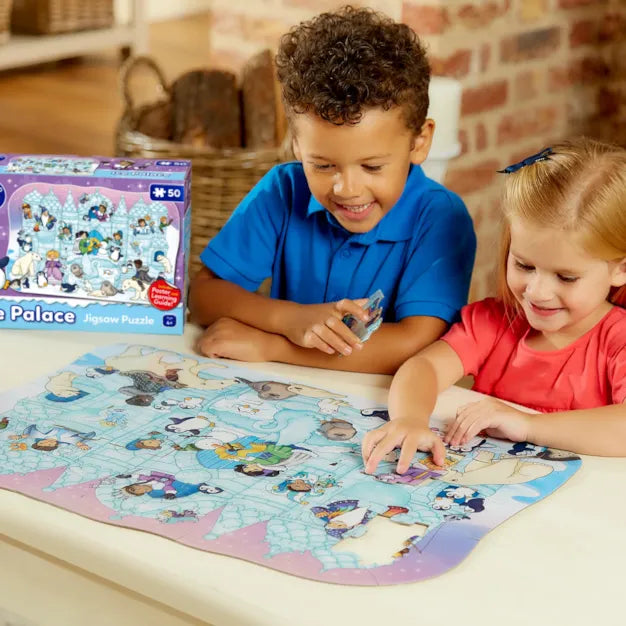 Includes a giant poster Two children playing with a Palace Puzzle on a table.