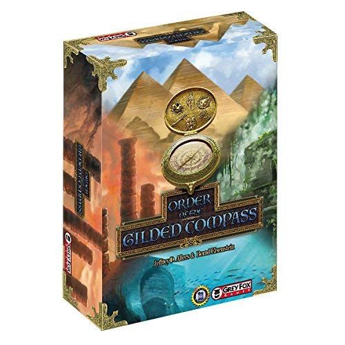 Board game box for 'Gilded Compass' with pyramids and compass design on a white background. Order of the Gilded Compass Board Game
