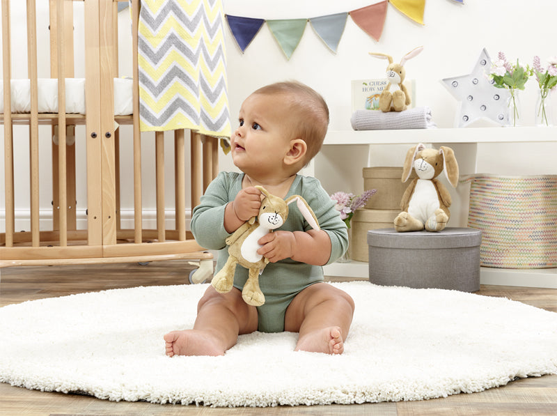 This cute Guess How Much I Love You Hare Rattle is made from baby soft plush and has a gentle chime. Sold by Say It Baby Gifts