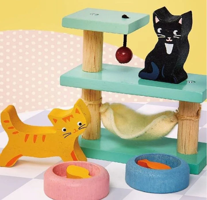 Tender Leaf Pet Cats Set - Wooden cat toy with multiple levels, a black cat figure, and various cat-themed accessories on a polka dot background.