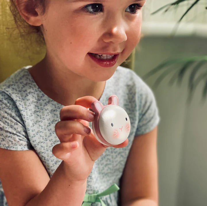 Animal Macarons Wooden Toy Set by Tender Leaf Toys – Cute & Colorful Play Food! child holding a small pink rabbit-shaped object