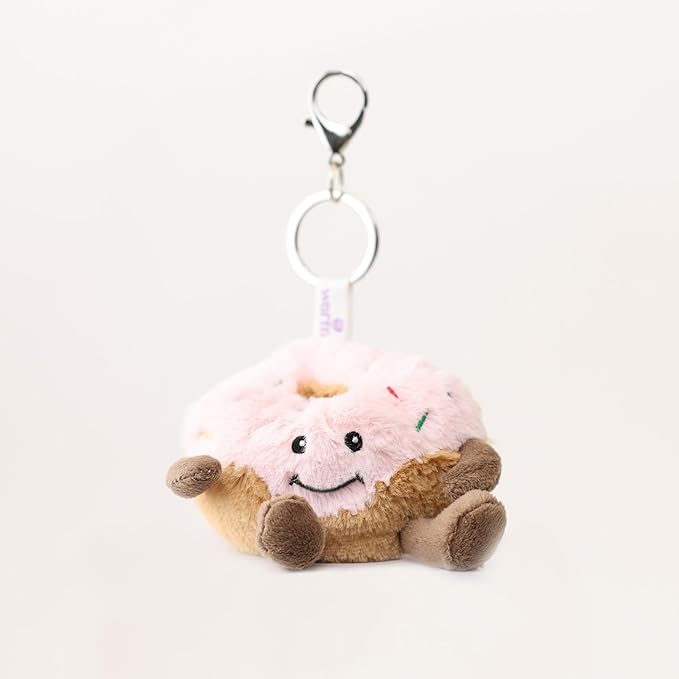Warmies Donut Bag Charm - Plush doughnut keychain with a smiling face on a cream background