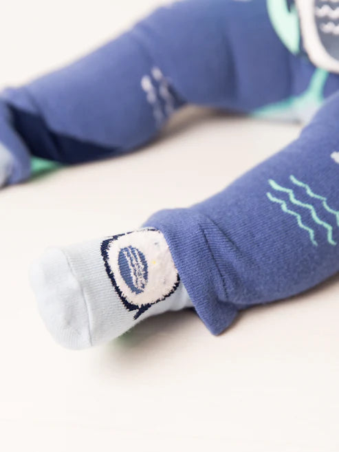 Blade & Rose Arctic Friends Socks - bold, bright and fun! These festive socks in pale blue feature a penguin and contrasting green detail heel.