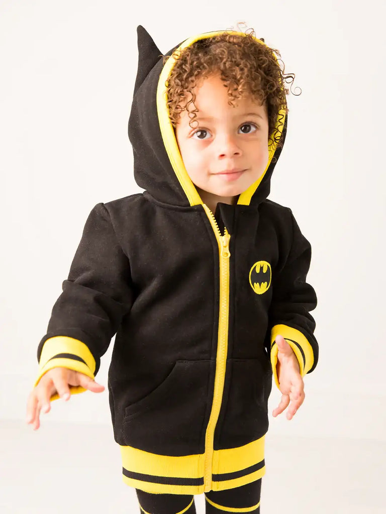Blade & Rose Batman Hoodie. Child wearing a black and yellow hoodie with a Batman logo on a white background
