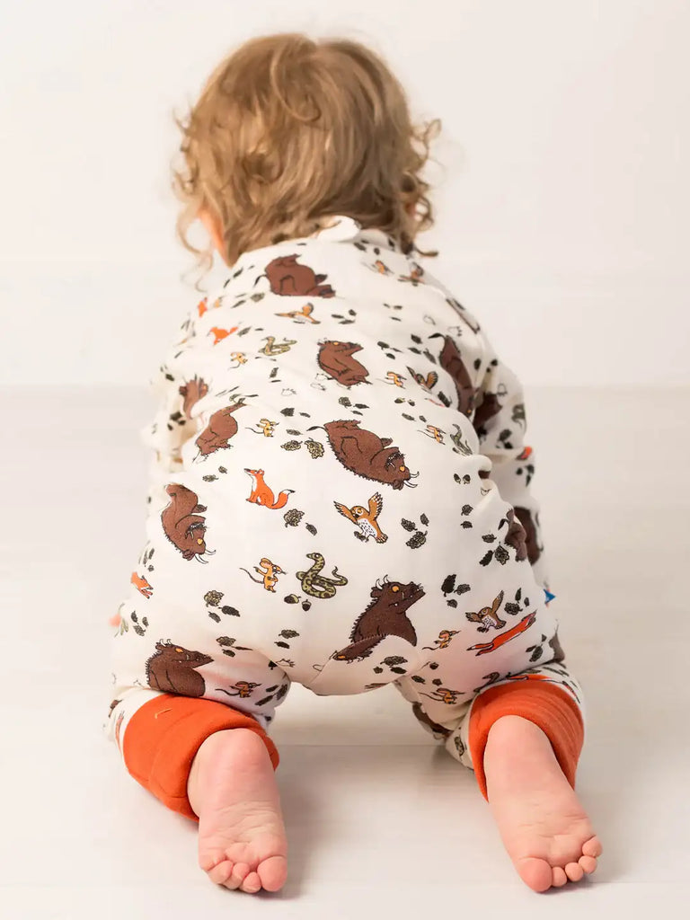 Blade & Rose Gruffalo Zip-Up Romper. Child wearing a patterned onesie with animal designs on a plain background