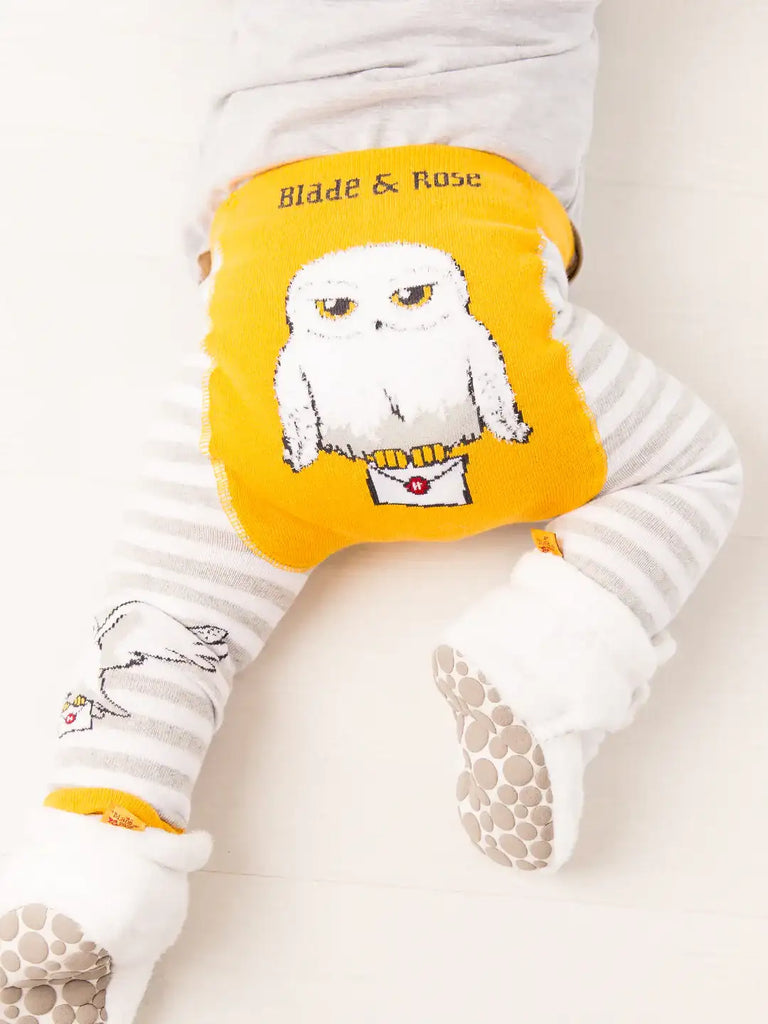 Blade & Rose Harry Potter Hedwig Owl Leggings. White baby outfit with a yellow owl design and 'Blade & Rose' text on a white background