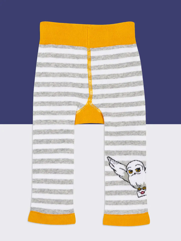 Blade & Rose Harry Potter Hedwig Owl Leggings. Striped leggings with owl design and yellow accents on a blue and white background
