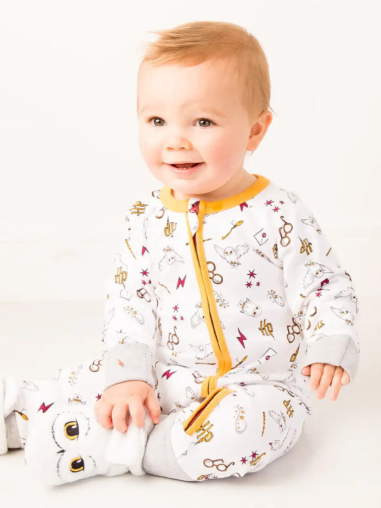 Blade & Rose Harry Potter Hedwig Owl Zip-Up Romper. Baby wearing a patterned onesie with yellow accents on a white background