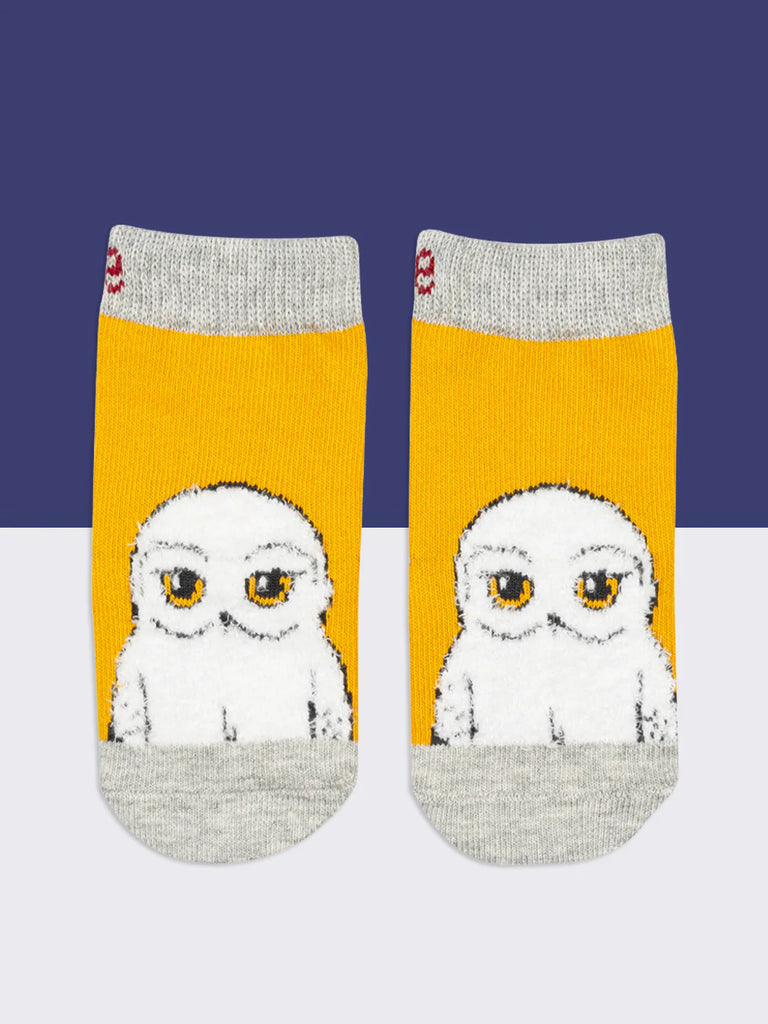 Blade & Rose Harry Potter Hedwig Owl Socks. Pair of socks with owl design on a yellow background