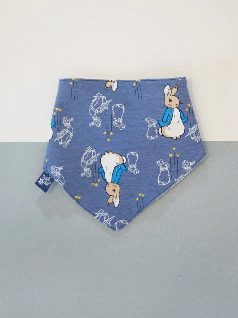 Blade & Rose Peter Rabbit Modern Mix Bib - bold, bright and fun! This gorgeous bandana bib in dark blue features an adorable Peter Rabbit design. Sold by Say It Baby Gifts