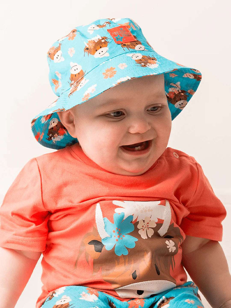 A gorgeous sunproof summer hat with an adorable Bonnie the Highland Cow design.