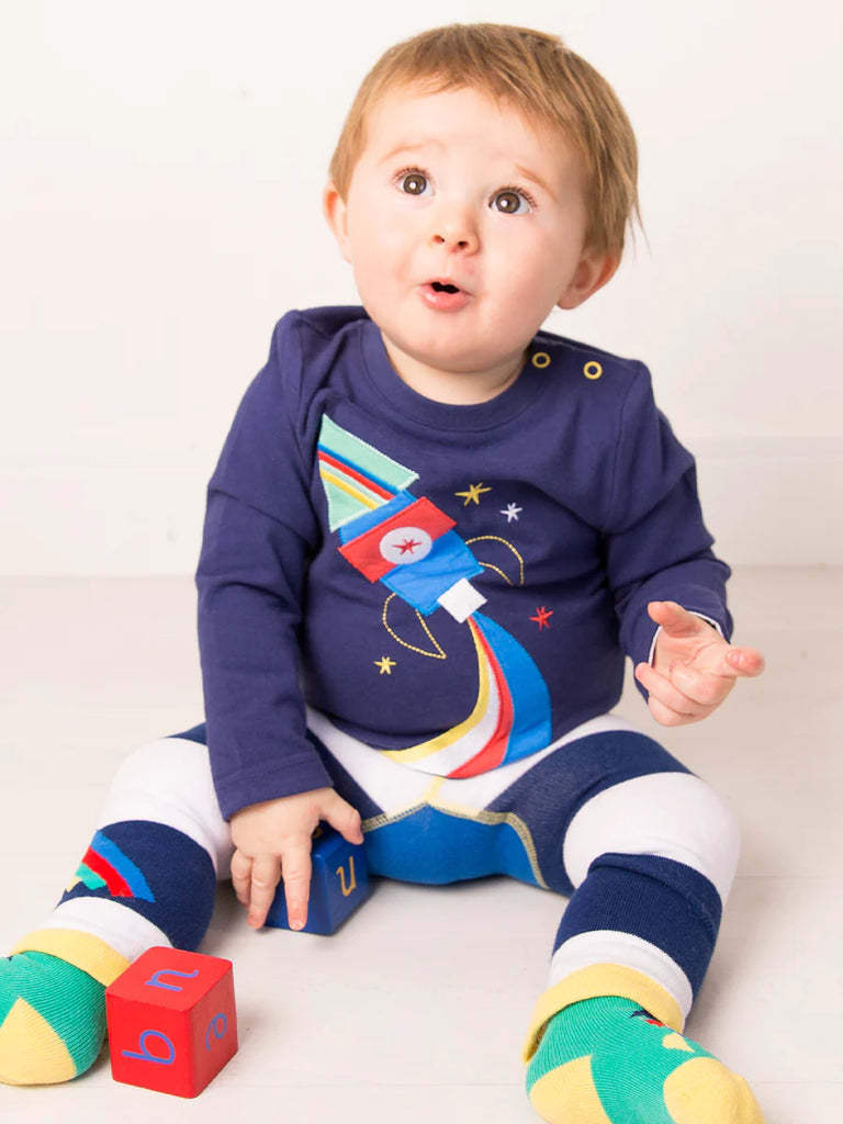To The Moon And Back Top - bold, bright and fun! This gorgeous navy blue top features a bold and colorful rocket ship applique design on the front, perfect for any aspiring astronaut!