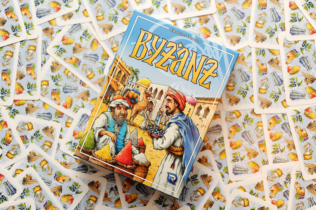 Board game box titled 'Byzanz' surrounded by game cards featuring illustrations of buildings and people.