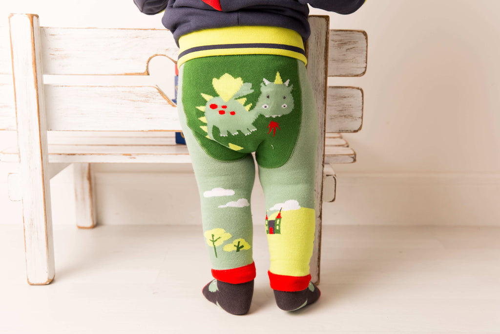 Blade & Rose Teddy The Dragon Leggings. Child wearing green leggings with dragon design in a home setting