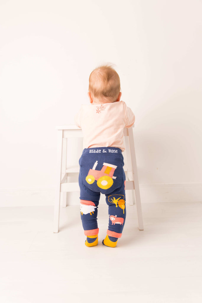 Blade & Rose Meadow Farmyard Leggings Child wearing colorful leggings with a cartoon design on a white background