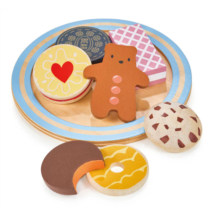 Mentari Tea Time Biscuit Plate. Wooden toy set with gingerbread man, cookies, and a cake stand on a white background