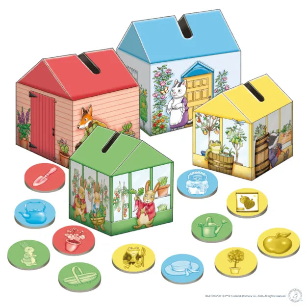 Orchard Toys Peter Rabbit Posting Game. Set of colorful house-shaped card games with character illustrations on a white background