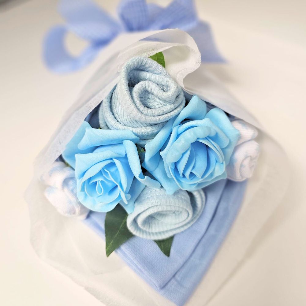 This gorgeous combines our handmade Mini Baby Boy Clothes Bouquet with the softest Jellycat Cordy Roy Elephant Comforter.