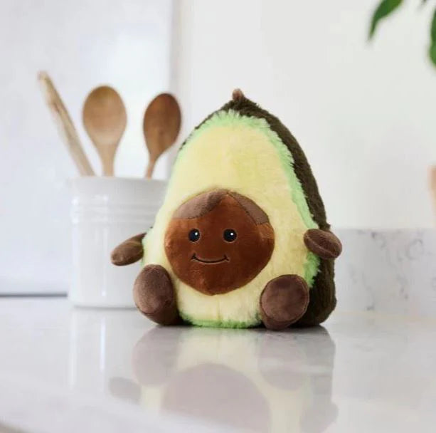 Warmies Junior Avocado - Plush avocado toy on a kitchen counter