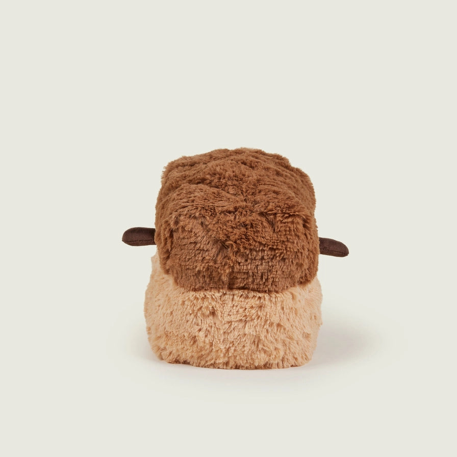 Warmies Loaf of Bread - Plush toy loaf with a smiling face on a beige background - back view

