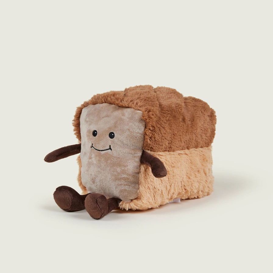 Warmies Loaf of Bread - Plush toy loaf with a smiling face on a beige background
