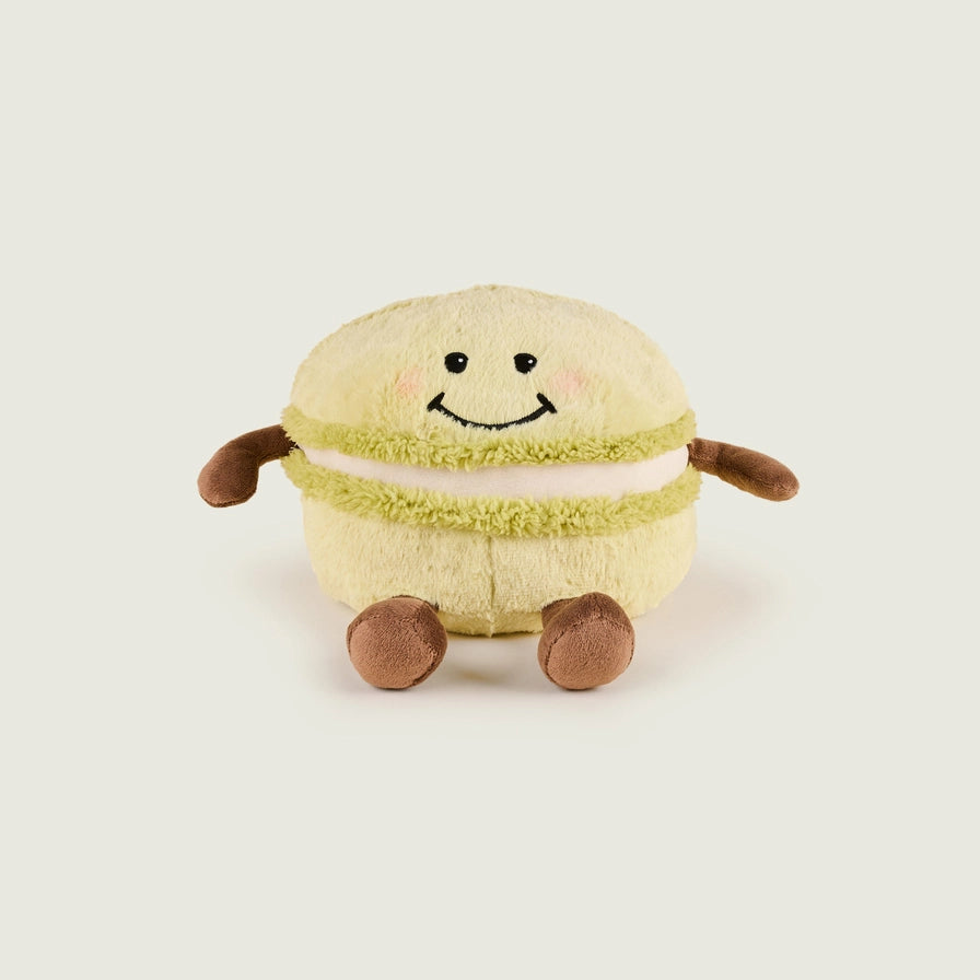 Warmies Macaroon - Plush toy macaron with a smiley face on a beige background