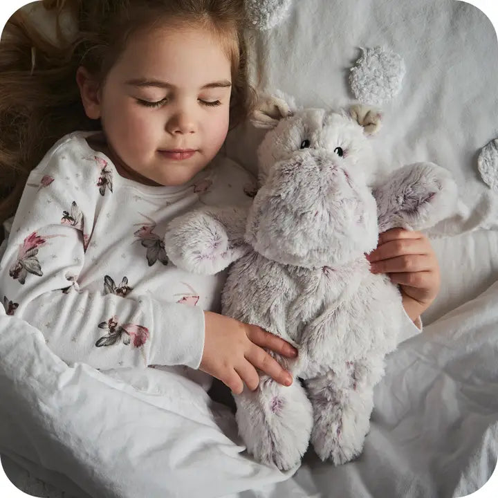 Warmies Marshmallow Hippo - lilac coloured hippo soft toy - child cuddling