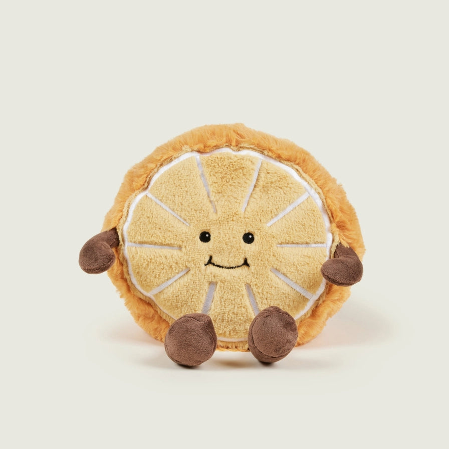 Warmies Orange Plush toy orange with a smiling face on a beige background - front view