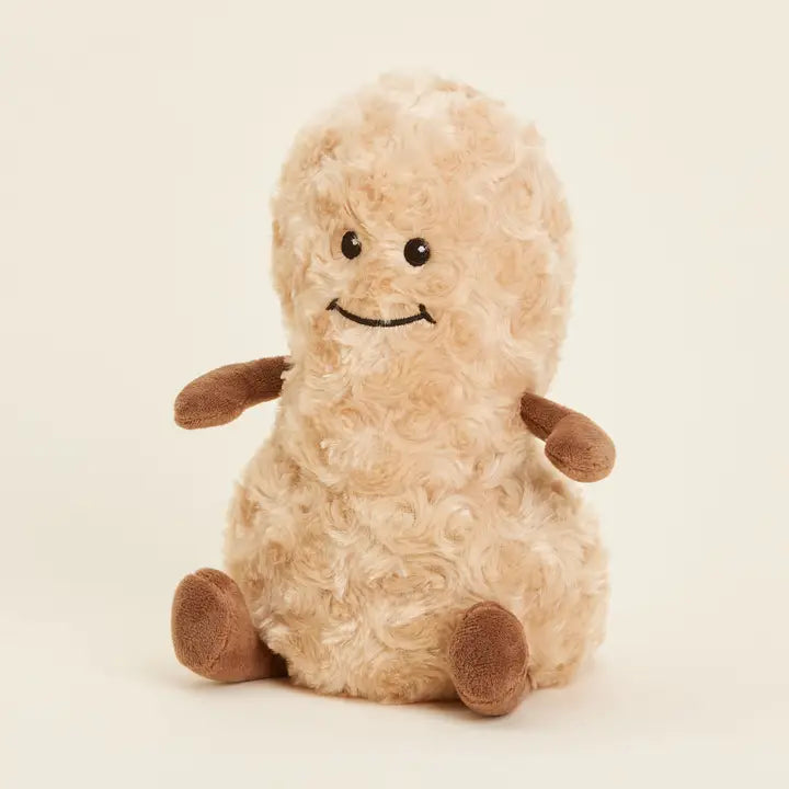 Warmies Peanut - Plush toy peanut with brown feet and arms on a beige background