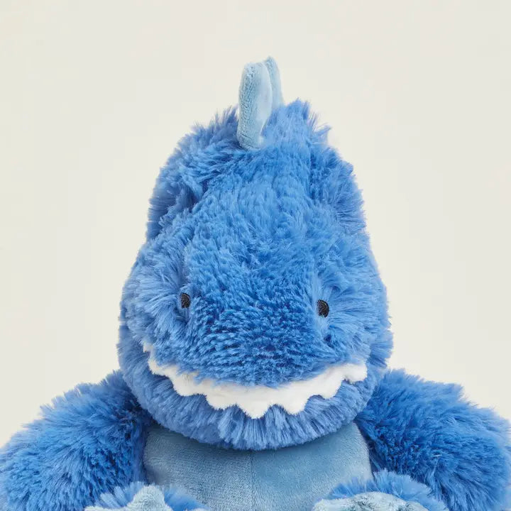 Warmies T-Rex - Blue plush dino toy on a light beige background - front
