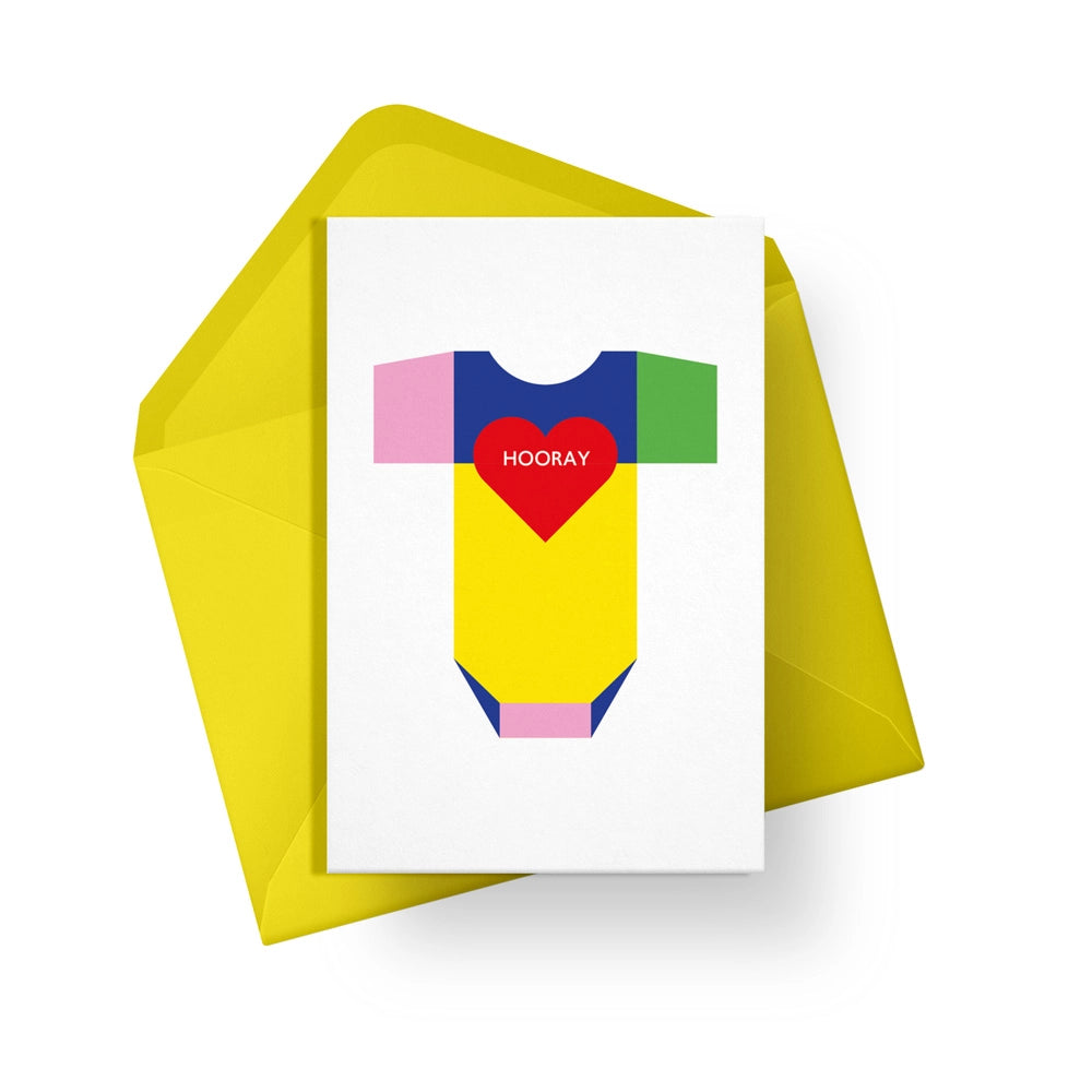 This colourful card from Alphabots features a rainbow coloured baby onesie with the words "Hooray"