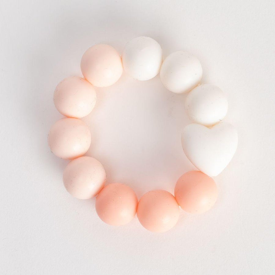 Bambino by Juliana Silicone Bead Teether - Pink. The teether is made from environmentally friendly silicone rubber, is durable and long lasting. It's perfect for massaging baby's tender gums and for stimulating emerging teeth.. Say It Baby Gifts
