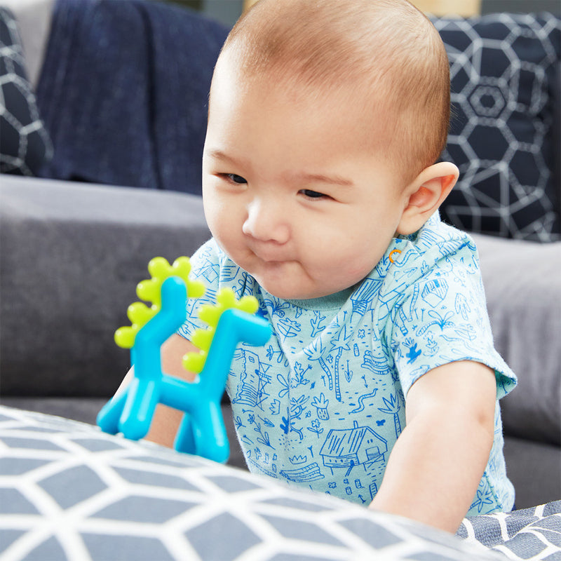 Boon Growl Silicone Teether Dragon. Growl features multiple textures to soothe irritated gums and is made from super sturdy silicone so it’s safe for your future paleontologist to gnaw away on. Hooray for the extinction of teething pain.