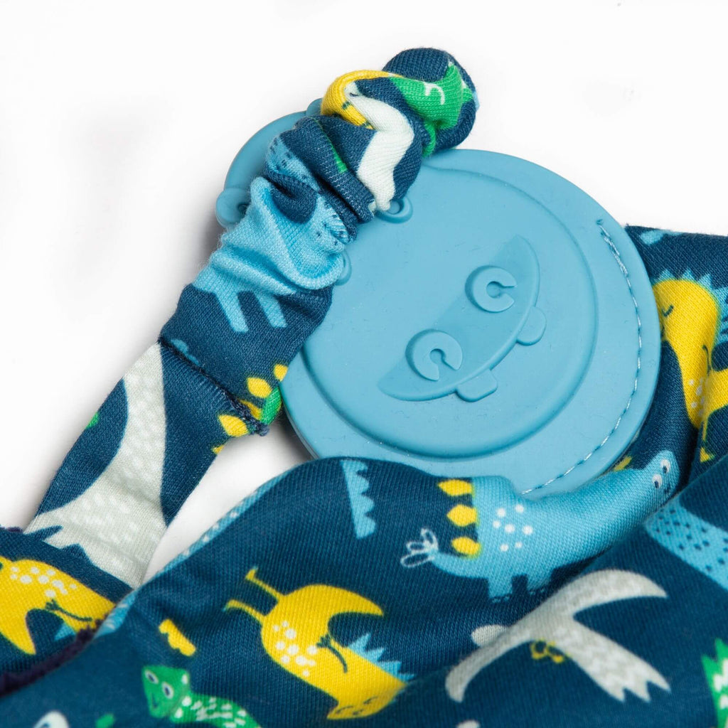 Cheeky Chompers Baby Dino Comforter & Teether. With handy elasticated strap, it can also be easily attached to the pram or baby's wrist for on-the-go chewing! A fab gift for baby.