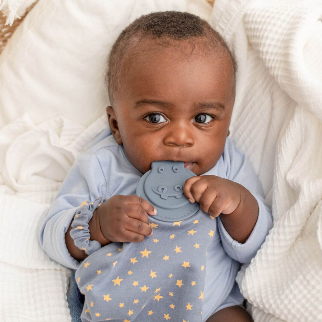 Cheeky Chompers Midnight Stars Comforter & Teether. It also features a soft cuddly fleece reverse in blue, sensory ribbons for baby to play with and a teether especially designed to massage and soothe tender little gums.