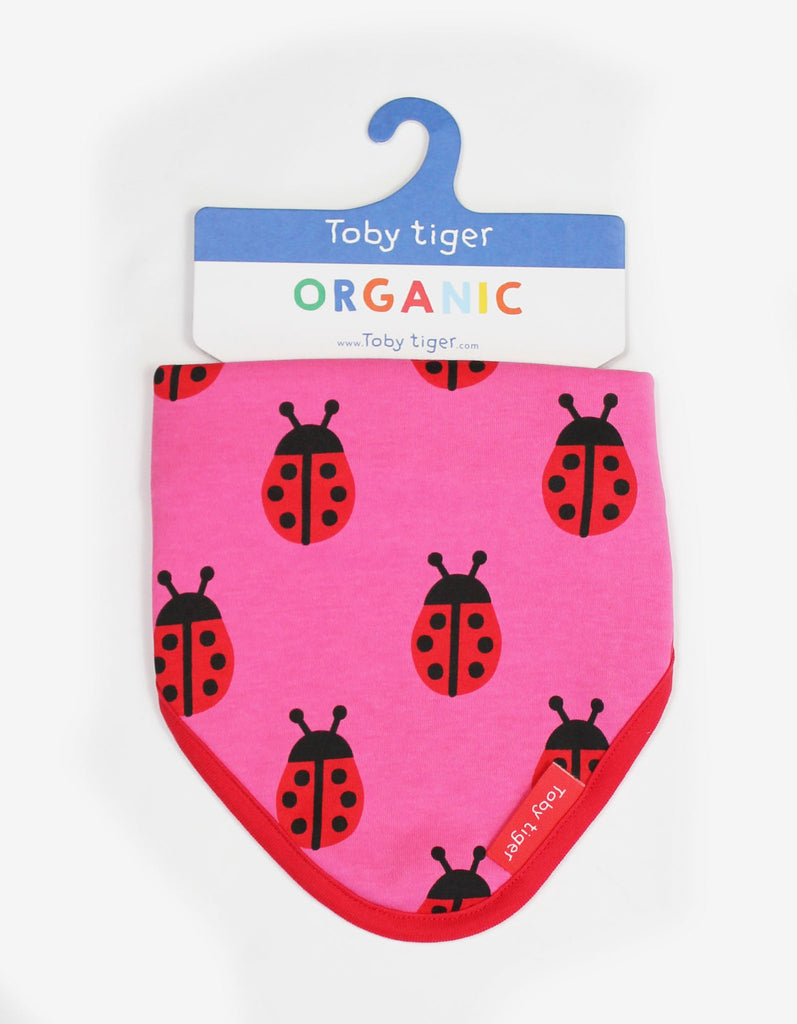 Toby Tiger Ladybird Dribble Bib - A gorgeous bib in pink featuring sweet ladybirds with a bold red trim. Sold by Say It Baby Gifts