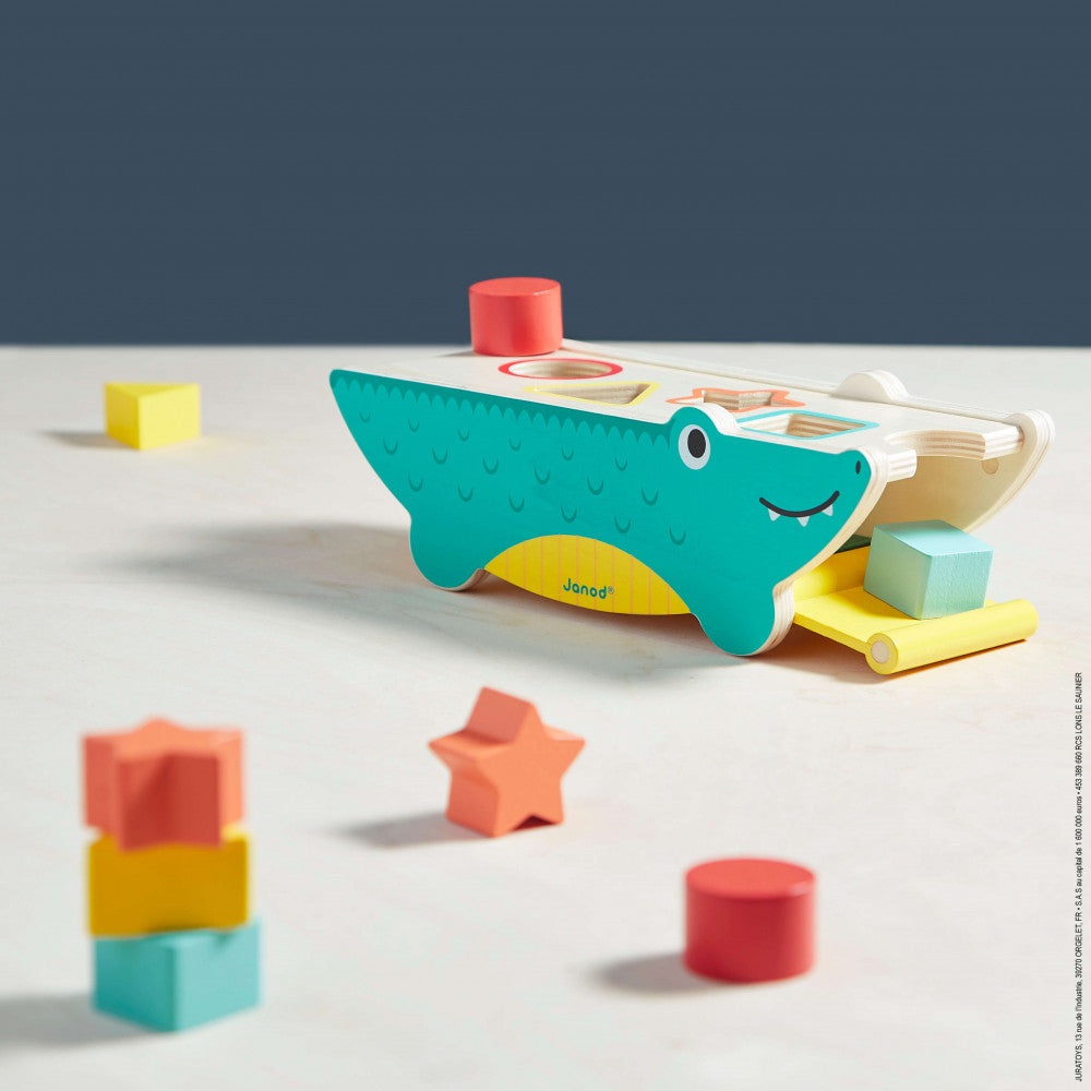 Janod Shape Sorting Crocodile - a colorful and fun shape sorting toy for age 12 months and up. Sold by Say It Baby Gifts.