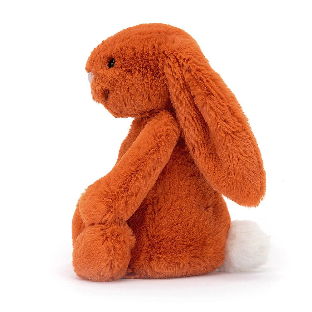 This super soft Jellycat Bashful Tangerine Bunny has citrus orange fur, a pastel-pink nose and the cutest white bob tail! BASS6BTA. Sold by Say It Baby Gifts. Side view.