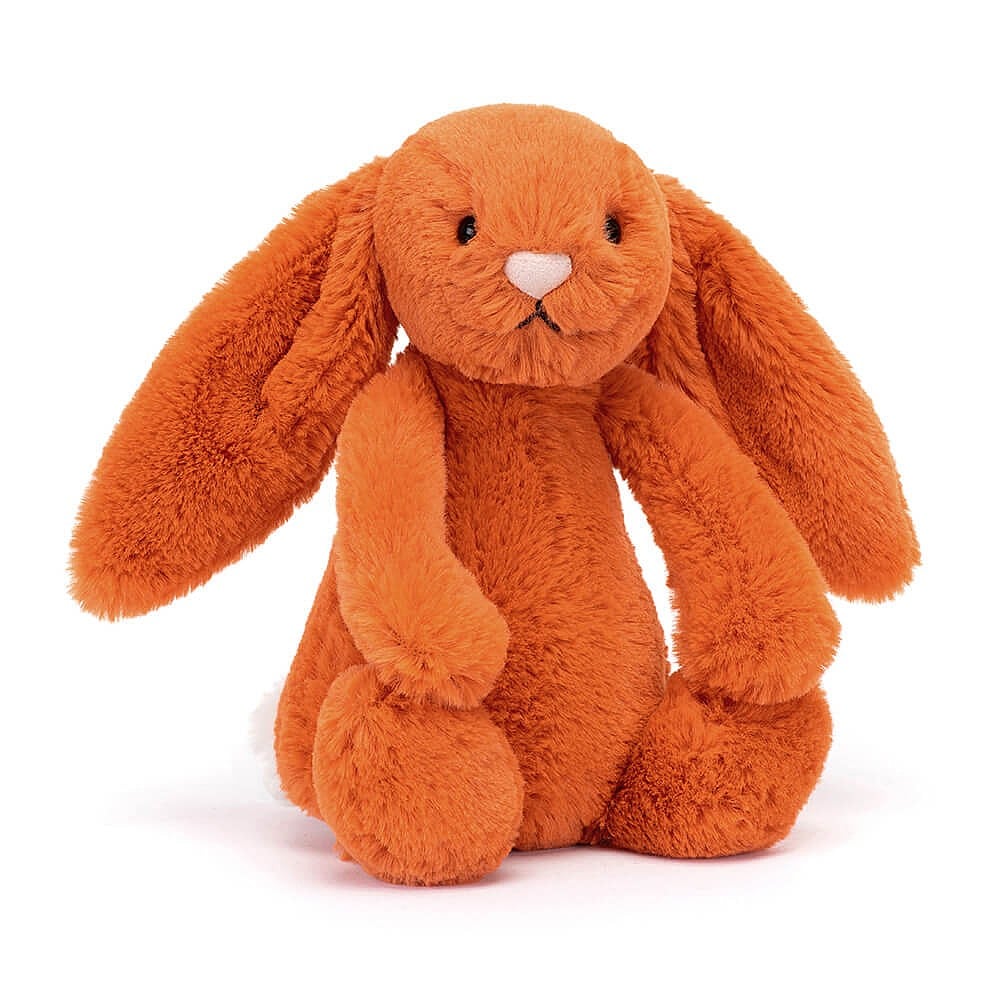 This super soft Jellycat Bashful Tangerine Bunny has citrus orange fur, a pastel-pink nose and the cutest white bob tail! BASS6BTA. Sold by Say It Baby Gifts. Front view.
