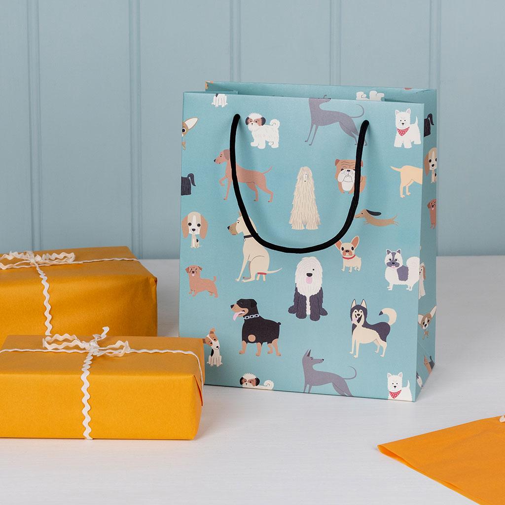 Small paper gift bag with string handles with cute "Best in Show" dog design. by Rex London