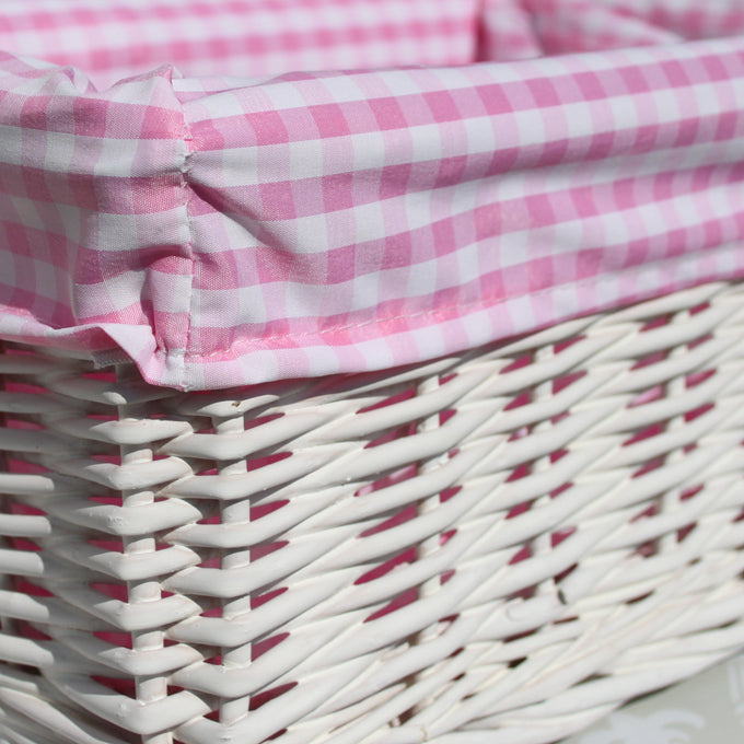 White Wicker Basket with Pink Gingham Lining - Small. Dimensions : 24x18x12cm. Sold by Say It baby Gifts. Empty Basket - contents not included