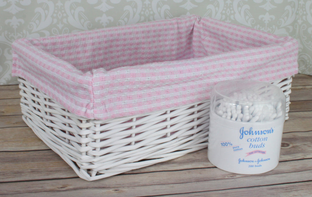 White Wicker Basket with Pink Gingham Lining - Medium. 35x24x12cm high. Sold by Say It Baby Gifts